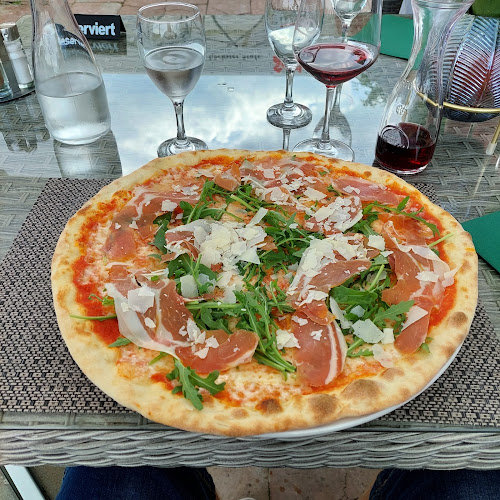 Pizzeria Magno Rif am Golfplatz - Gastronomie und Hotellerie